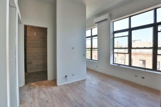 Building Photo - Brand New Studio in Wicker Park. 12' Ceilings. Huge Windows, Elevator Building. Roof Deck. Free I...
