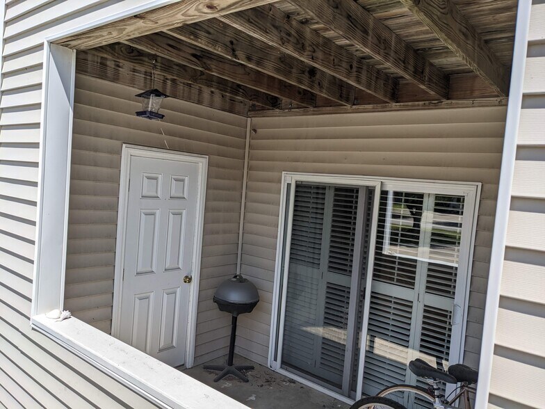 The unit includes 3 outdoor, lockable storage closets. The outdoor porch is great for entertaining. - 424 Commerce Ave