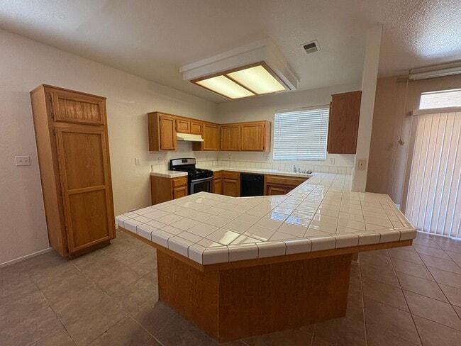 Building Photo - Spacious 3 Bedroom, 2 Bath Tevis Ranch Home with Fireplace, Covered Patio & 2-Car Garage