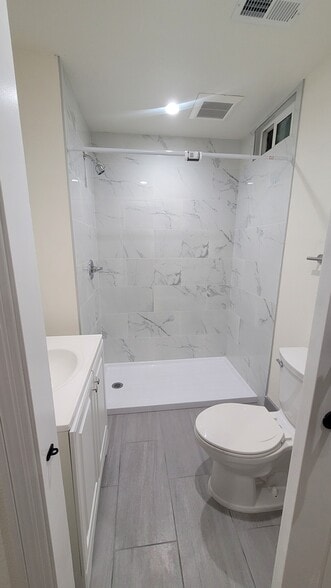 Bathroom 2: in main bedroom with chic barndoor, large low step-in shower - 646 10th Ave
