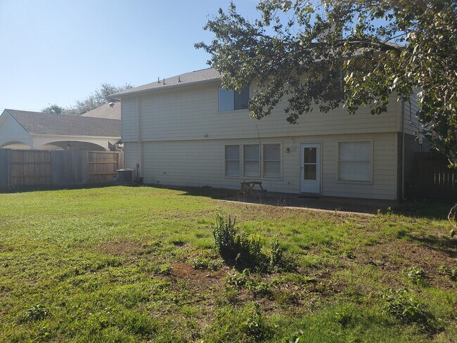 Backyard looking at house - 10838 Cliffton Forge Dr