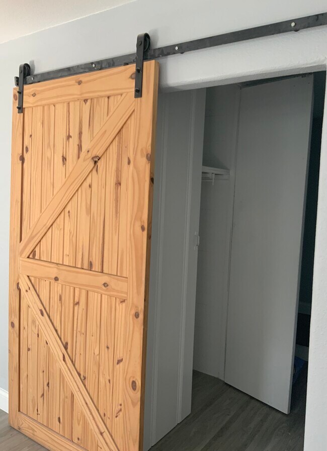 Barn door access up to 2nd floor staircase - 3816 Byers Ave