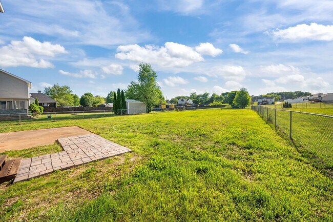 Building Photo - Charming Brick Home with Soaring Ceilings & Updated Finishes!