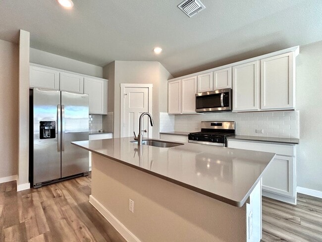 Building Photo - Move-In Ready Home with Open Layout & Outdoor Entertaining Space