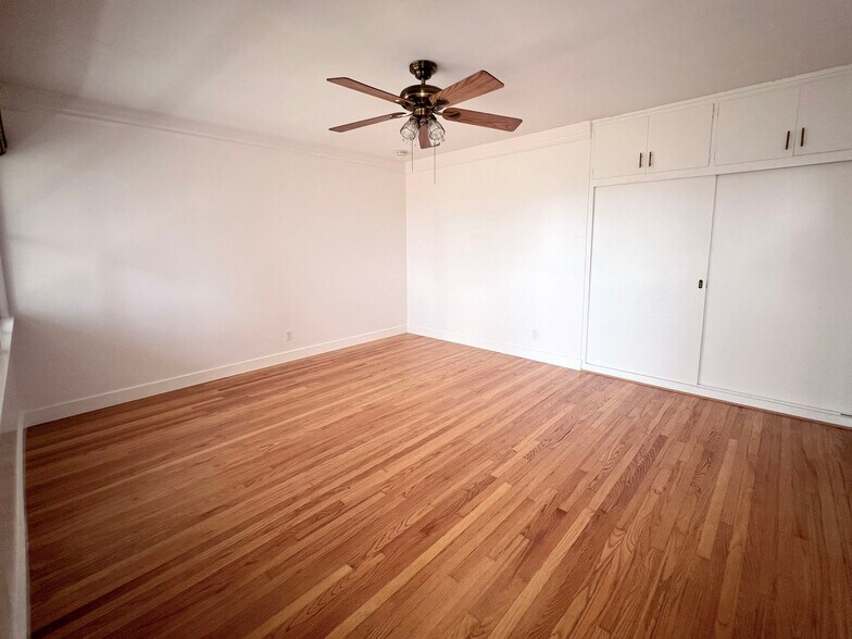 Bedroom with built in storage cabinets, closet. - 1327 N Central Ave