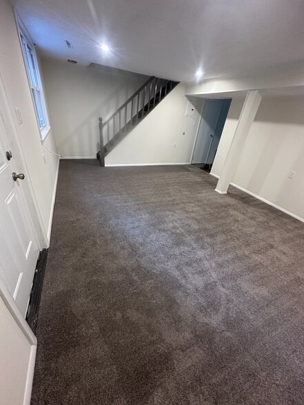 Living room with staircase to 2nd floor bedrooms - 105 Red Mill Rd