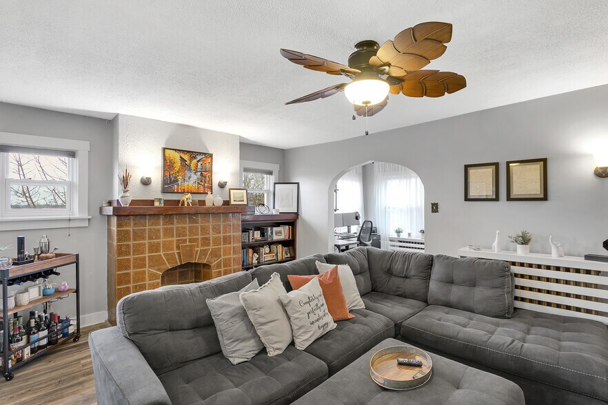 Bright and spacious living room featuring abundant natural light and vinyl flooring. - 203 Richbarn