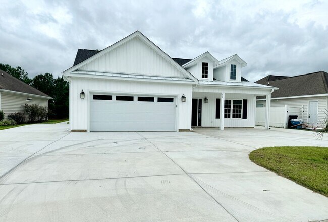Building Photo - LOOK AT THIS ONE! BEAUTIFUL home with a pond view right outside the back patio!