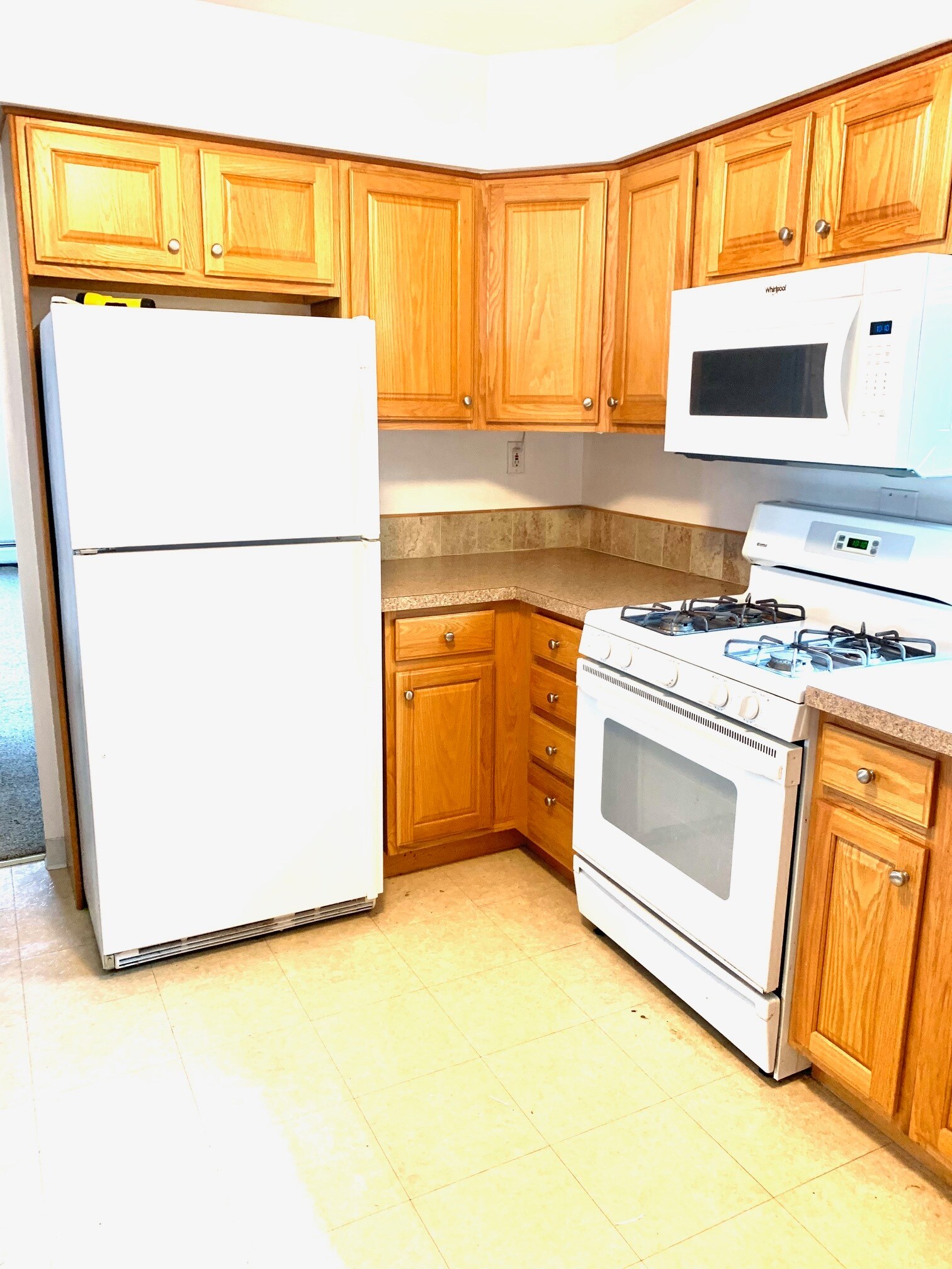 Kitchen showing refrigerator and range - 203 5th St