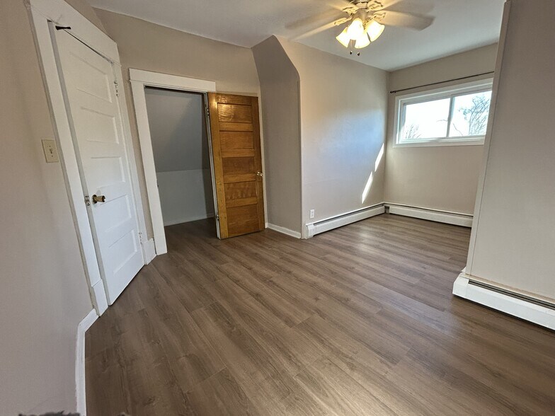 Bedroom 1 other view, with a walk-in closet. - 1231 Raymond Ave