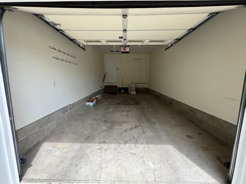 Extra deep garage attached with garage remote included. - 1343 Easy St