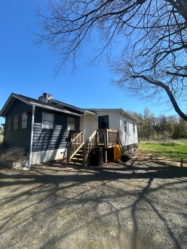 Building Photo - Charming Newly Renovated 2-Bedroom Home on 3 Acres – A Gardener’s Dream!