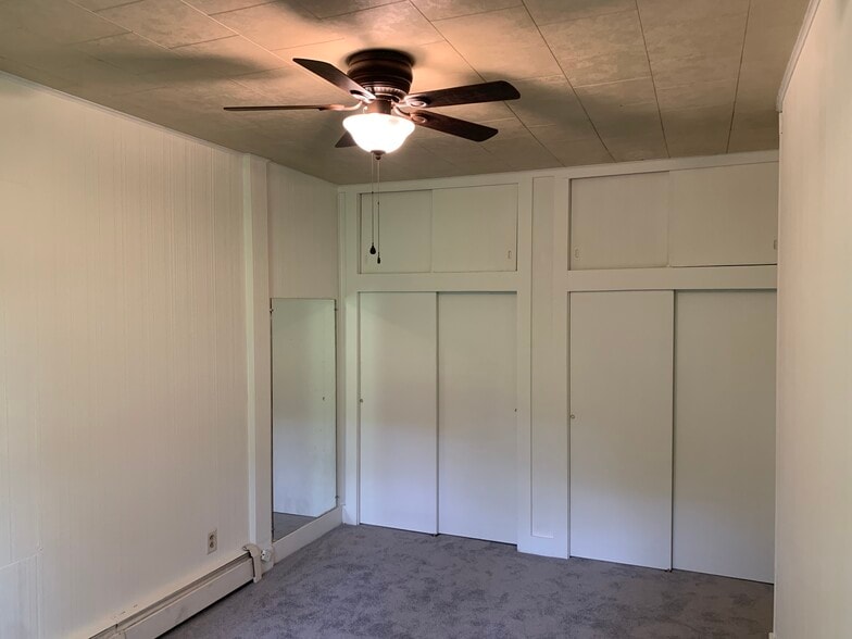 Bedroom 1, showing slide door to closet - 9121 Sheffield Ave