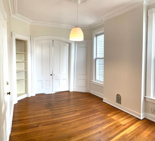 Living room with bedroom door closed - 22 Lyon St