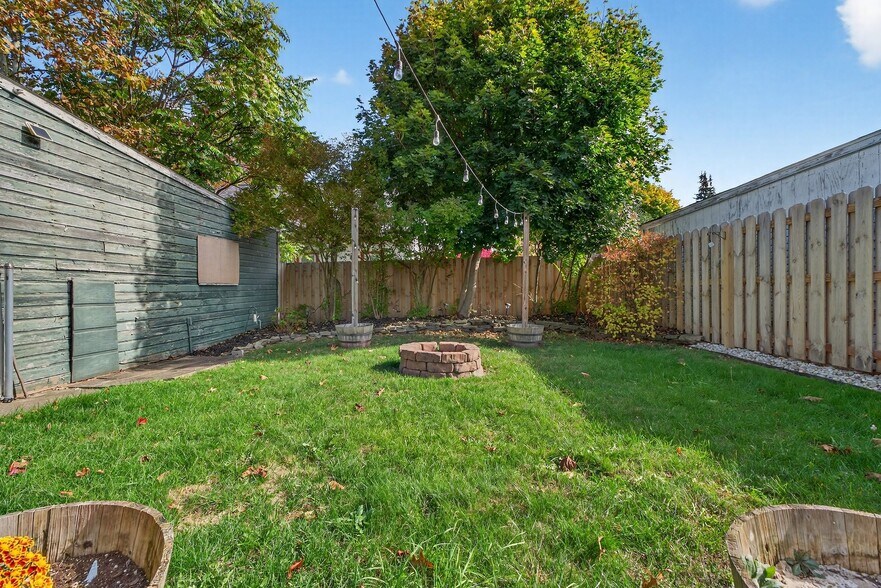 Backyard with Fenced in Yard and String Lights - 4429 S Hills Dr