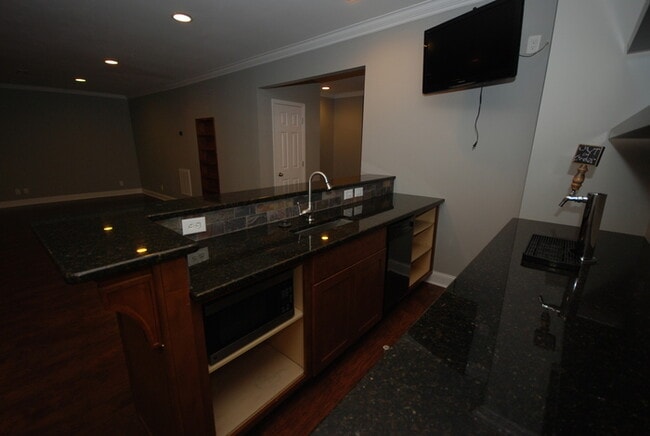Building Photo - Oversized Executive Style Home with Finish...