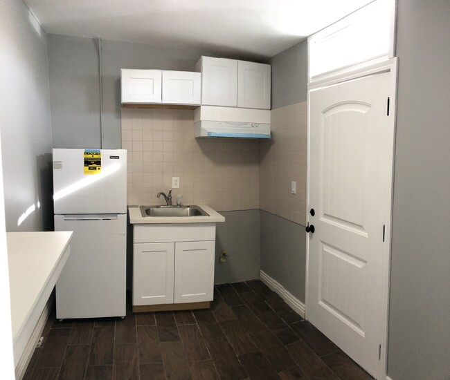 Kitchenette and door to outside - 5102 W 129th St