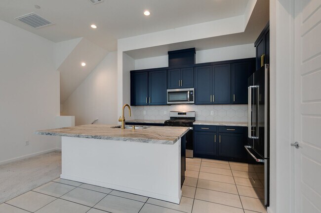 Building Photo - Stunning 4-Level Townhome in Inspirada | R...