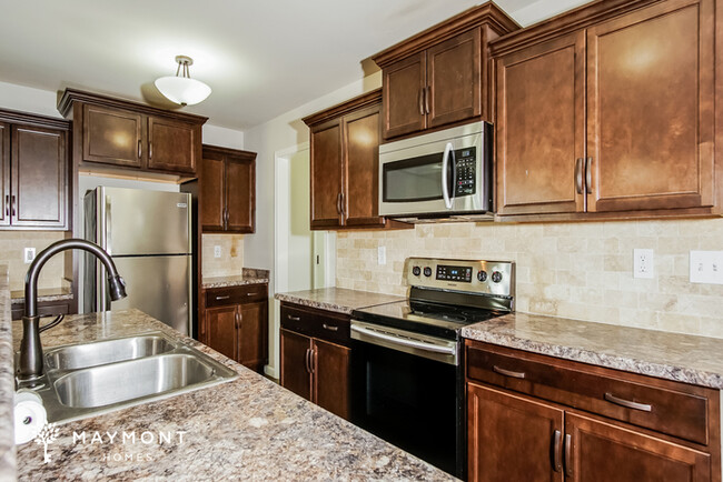 Building Photo - Spacious 4-Bedroom Brick Home