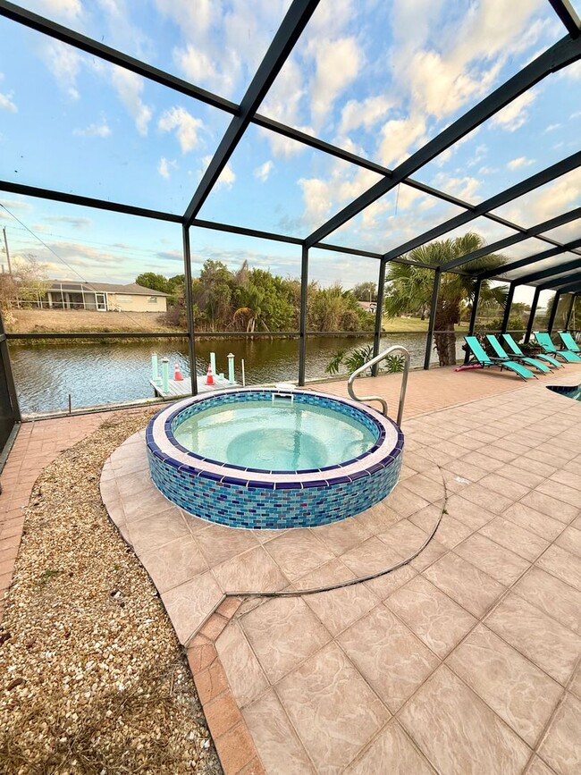 Building Photo - Stunning Furnished Pool him on Accessible Canal