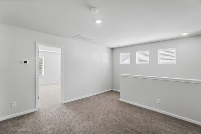 Building Photo - 4BR Home in The Pines at Paw Creek – New Construction + Private Deck