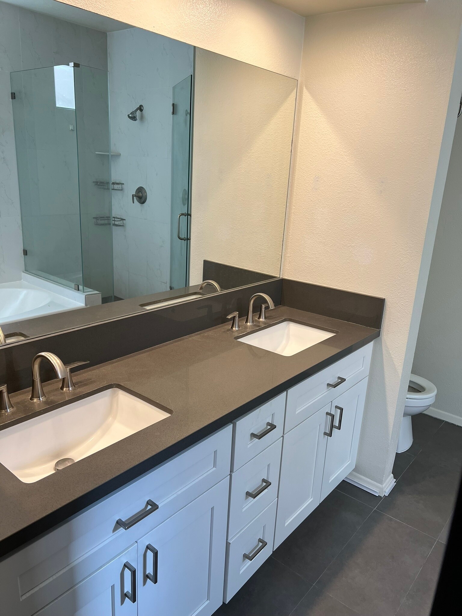 Remodeled bathroom with double sinks - 4707 Willis Ave