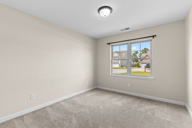 Building Photo - Spacious Home with Natural Light