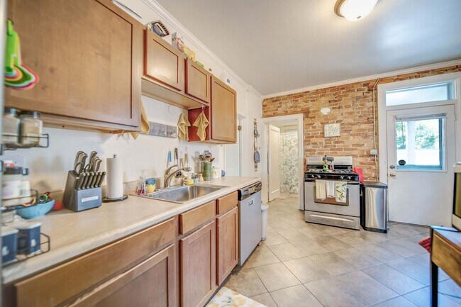 Building Photo - Charming 5-Bedroom Home with Exposed Brick and Modern Upgrades