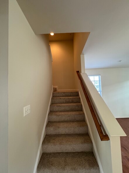 The stairs to the second floor...note the new premium carpeting and padding installed Aug. 27! - 44520 Gray Wolf St