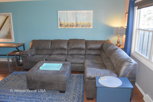 Furnished Living Room Large Couch 2 - 1028 Coppens Rd