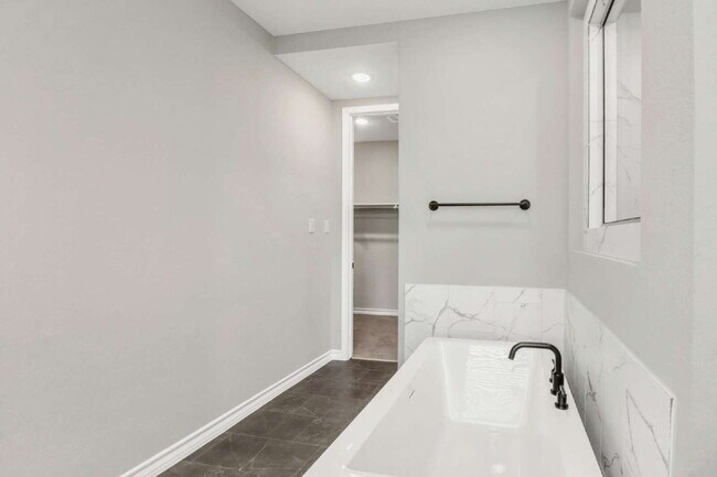 Building Photo - ASK ABOUT FREE APPLICATIONS THROUGH AUGUST!  "Spacious 4-Bedroom Sanctuary with Cozy Fireplace in...