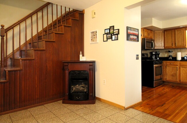 Welcoming foyer with granite tile floor for easy upkeep - 11 Columbia St