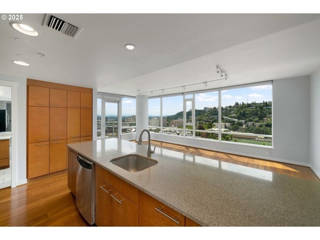 Building Photo - Modern 2-Bed/2-Bath Condo with Balcony & Prime Downtown Location