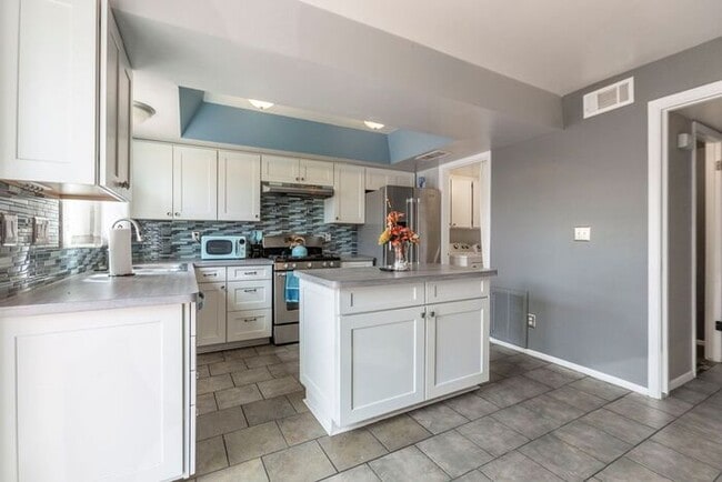Building Photo - Discover this charming two-story townhome