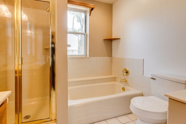 Building Photo - AVAILABLE June 2026 - Beautiful 4 Bedroom, 2 Bath Home w/ Front Porch Swing!