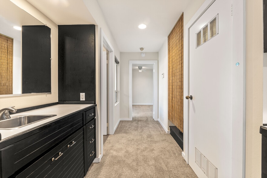 Hallway to bedroom with laundry closet on right - 1759 Silverwood Ter