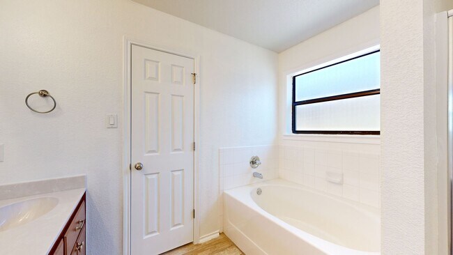 Building Photo - Completely repainted 4 bedroom ALL TILE ho...