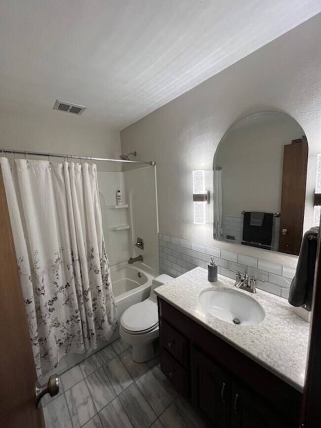 Building Photo - Spacious, Fully Updated Home with Walkout Basement on a Mature Lot