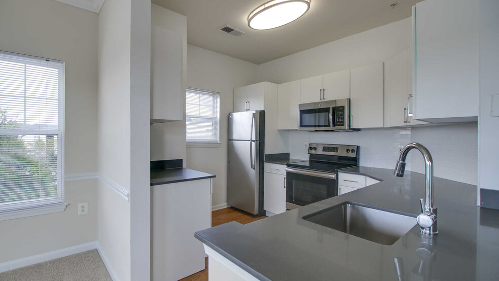 Kitchen with Stainless Steel Appliances - Reserve at Potomac Yard