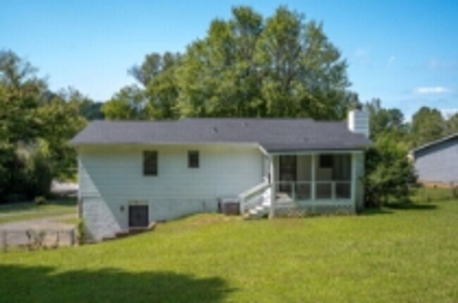 Building Photo - This beautifully updated brick home in Har...