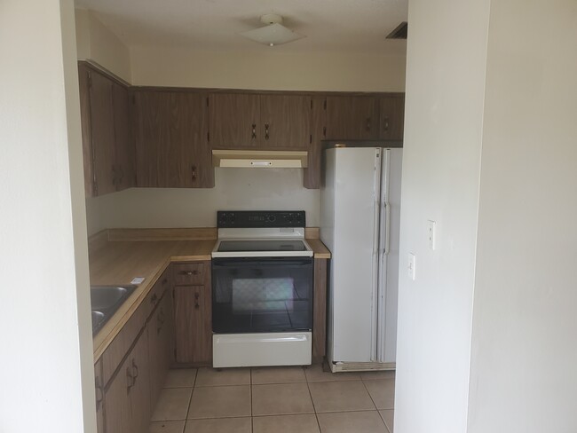 Kitchen from front door - 6538 W Norvell Bryant Hwy