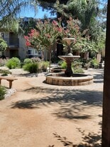 Courtyard w/ bbqs and fountain - Westside Village Apartments