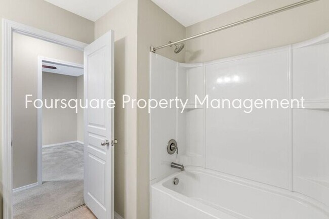 Building Photo - Charming Townhome with Open Layout, Back Patio & One-Car Garage – Near RTP, RDU & Everyday Conven...