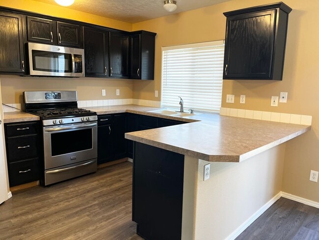Building Photo - 4 Bedroom Home with Bonus Room Potential & RV Parking!