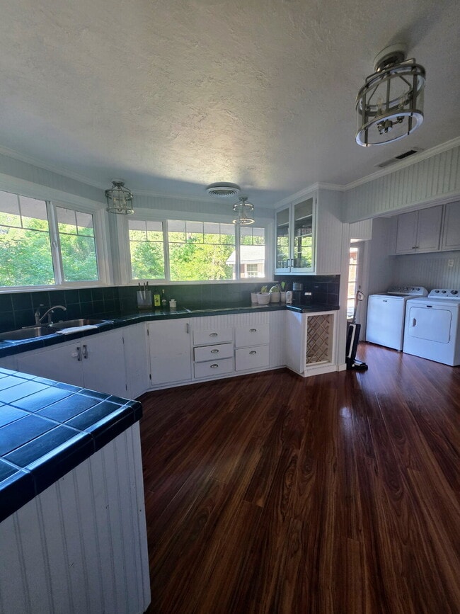 Building Photo - Breathtaking Home offers flexible living with bonus rooms ideal for an office, art studio, gym, o...