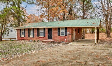 Building Photo - Cozy 3BR Home with Spacious Yard & XL Carport!