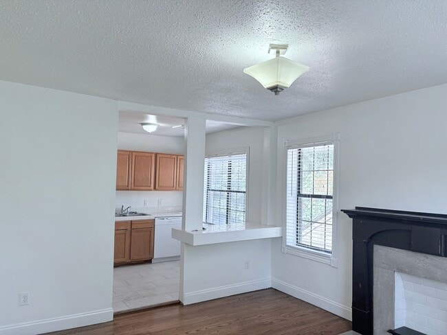 Building Photo - Vintage Charm Meets Downtown Convenience!