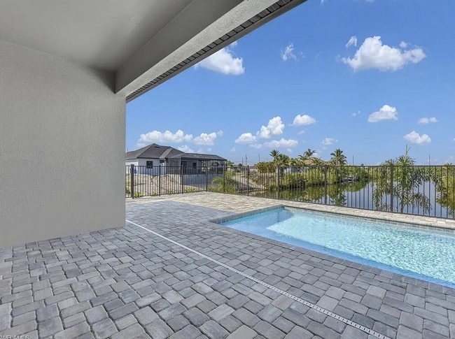 Building Photo - Almost New Construction Waterfront Home in NE Cape Featuring A Pool, Fenced Yard & More! COMING SOON