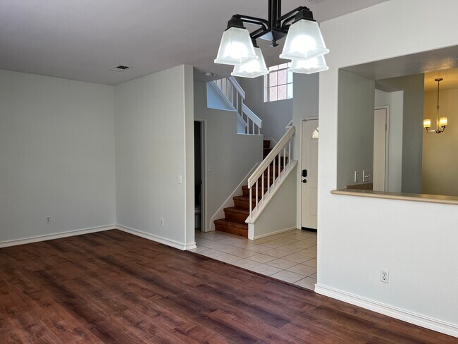 Living room to staircase view - 10924 Creekbridge Plz