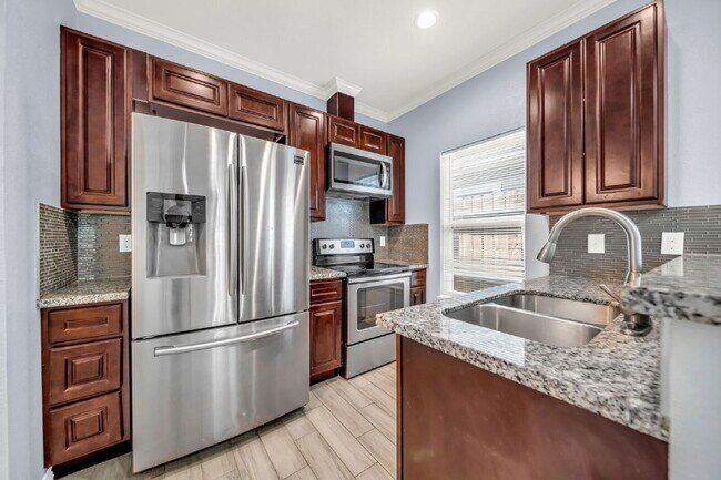 Building Photo - Welcome to this charming Craftsman-style residence nestled in the serene community of Lake Conroe...